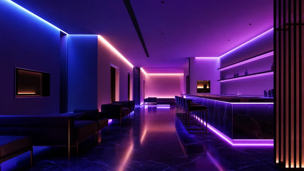 A sleek modern space is illuminated by vibrant purple and blue lights